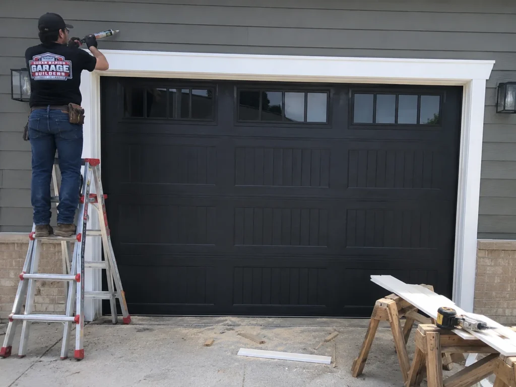 Garage door exterior trim installation in Cedar Rapids, Iowa.