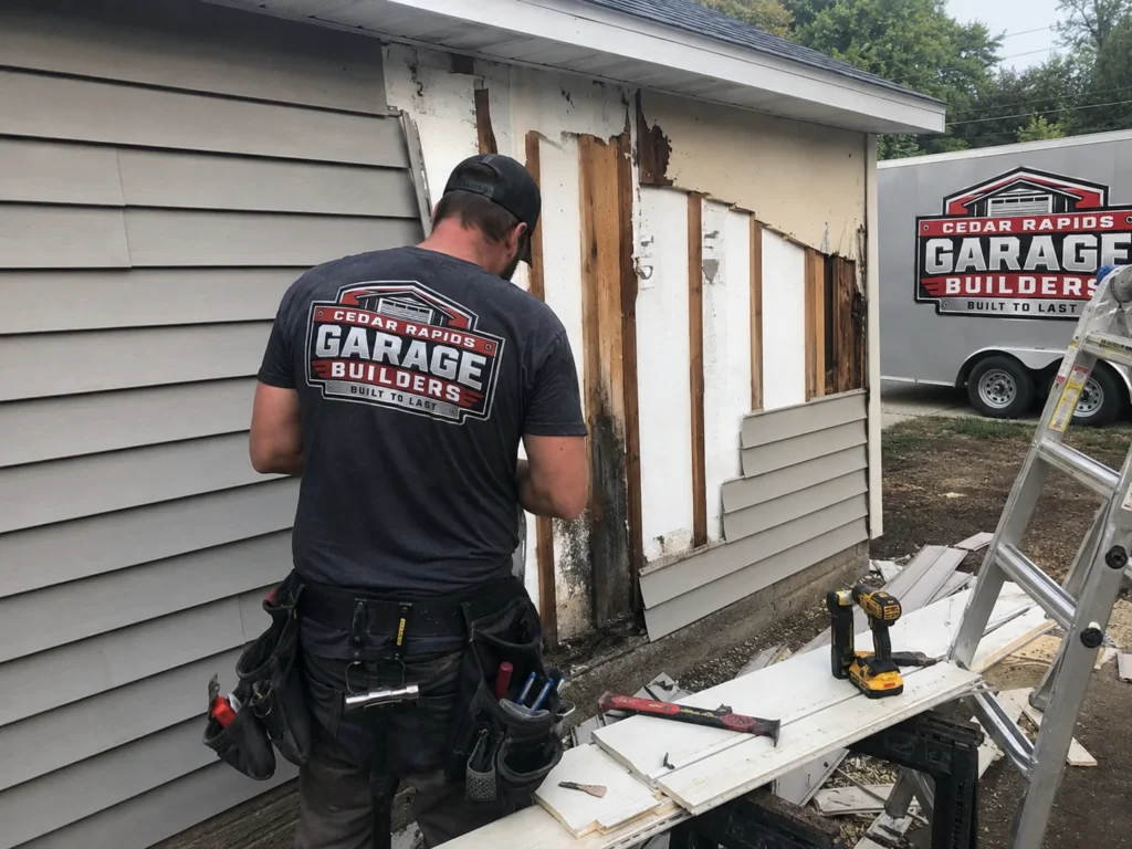 Garage siding replacement and wall repair in Cedar Rapids, Iowa.