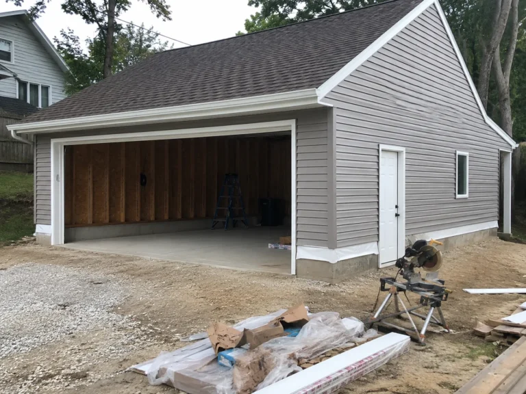 Completed detached garage with open bay in Fairfax, Iowa.