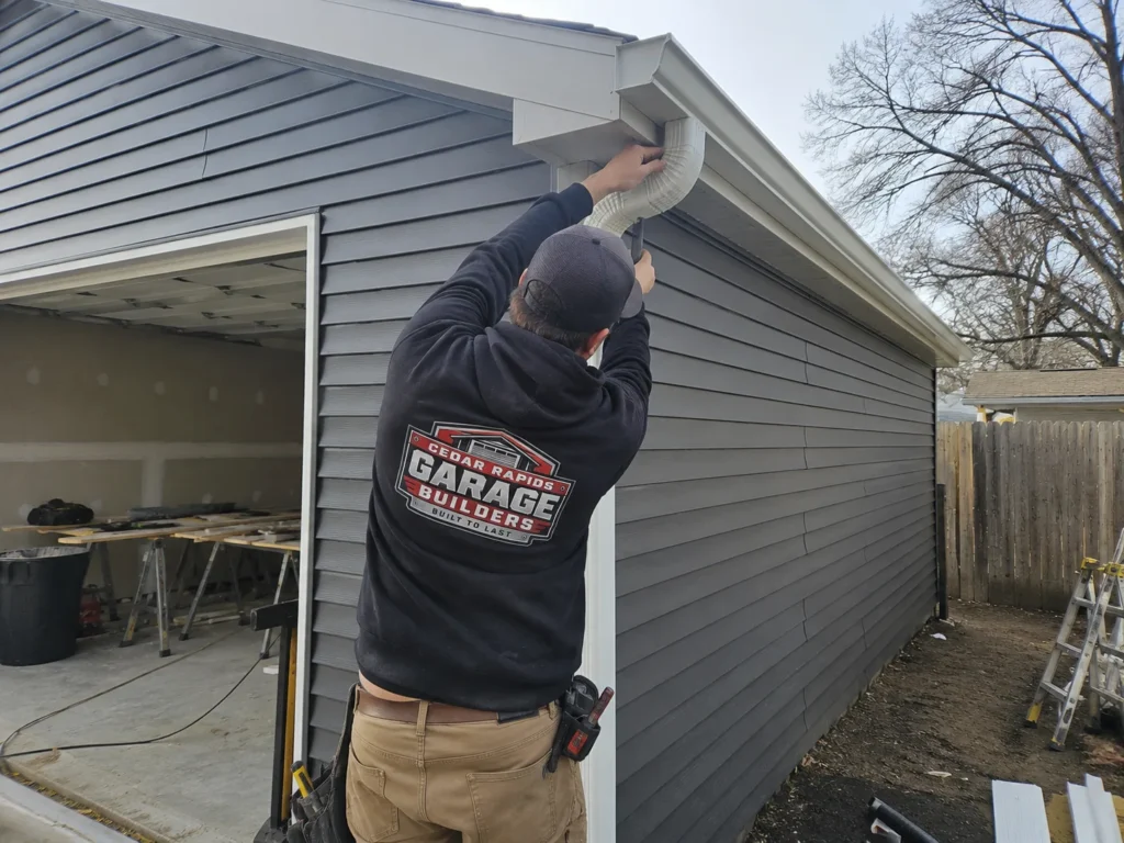 Garage gutter and eave trim installation in Hiawatha, Iowa.